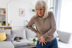 Older woman experiencing hip pain